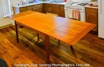 Solid teak dining room table with extensions